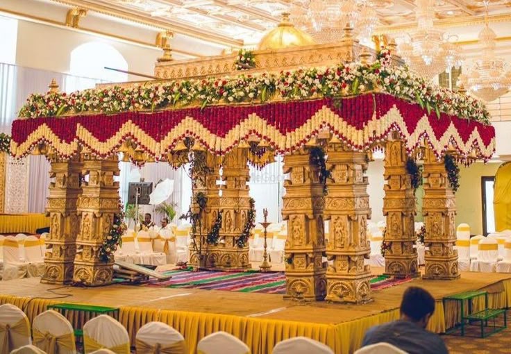Bright mehendi lounge decor with draped canopy