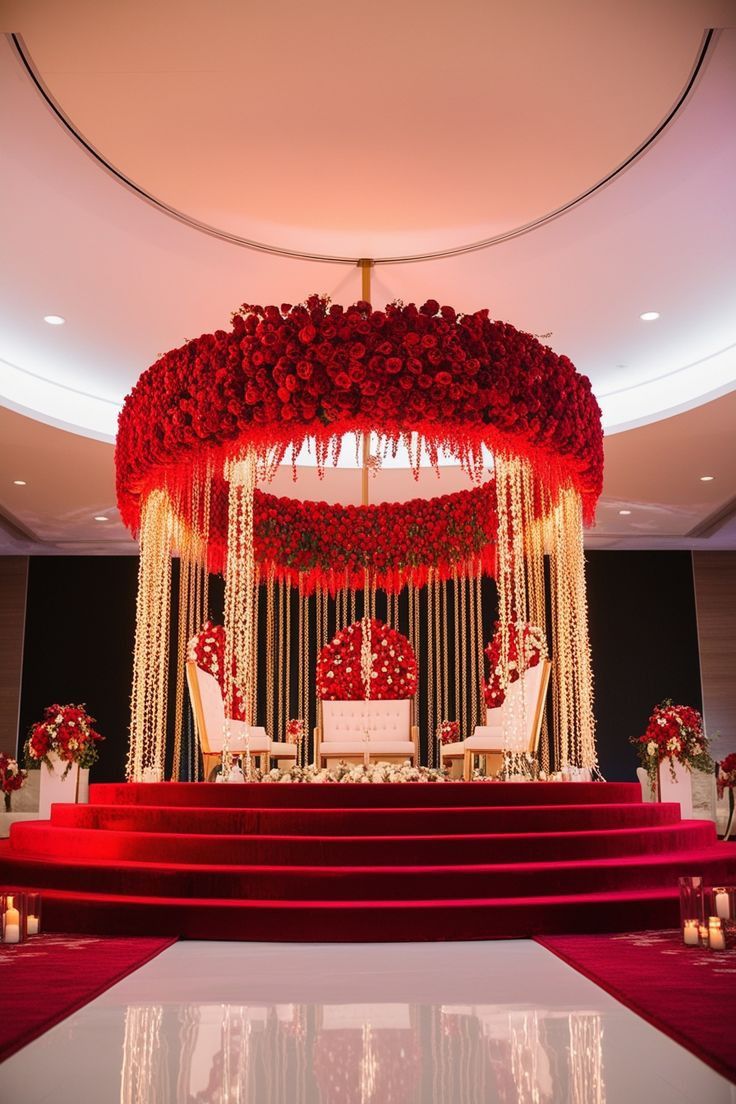 Red floral stage with hanging garlands